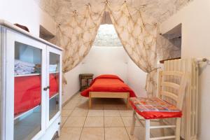 A bed or beds in a room at Trulli da Rosy