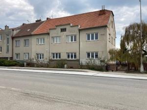 a large building on the side of a street at Apartment In The Garden in Držovice