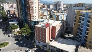 an aerial view of a city with tall buildings at Hotel Liss in Lezhë