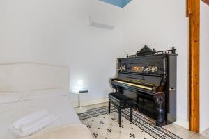 Posteľ alebo postele v izbe v ubytovaní Palazzo Montalbano