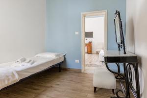 Posteľ alebo postele v izbe v ubytovaní Palazzo Montalbano