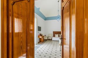 Posteľ alebo postele v izbe v ubytovaní Palazzo Montalbano