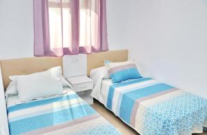 Posteľ alebo postele v izbe v ubytovaní Casa con piscina de agua salada III