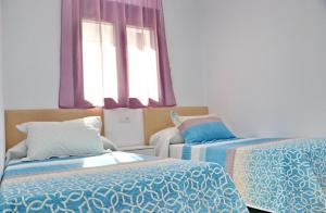 Posteľ alebo postele v izbe v ubytovaní Casa con piscina de agua salada III