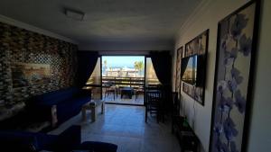 a living room with a view of a balcony at شاليه غرفتين بالمعمورة الشاطى على البحر صف ثان in Alexandria