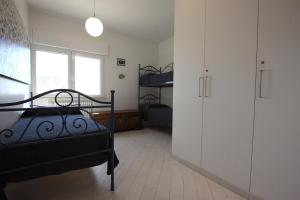 Ένα ή περισσότερα κρεβάτια σε δωμάτιο στο Villa Mareblu - Ansedonia