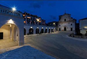 an empty courtyard of a building at night at Palazzo del Principe in Castel di Sangro