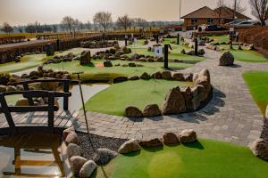 A garden outside Møn Golf Resort - Hotel Præstekilde