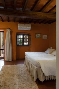 A bed or beds in a room at Albergo Del Chianti