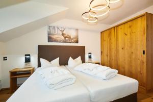 Postel nebo postele na pokoji v ubytování Hotel Rupertihof