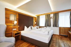 Postel nebo postele na pokoji v ubytování Hotel Rupertihof