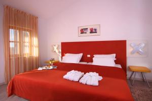 Voodi või voodid majutusasutuse VELANERA Hotel & Restaurant toas
