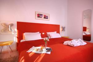Voodi või voodid majutusasutuse VELANERA Hotel & Restaurant toas