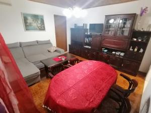 a living room with a couch and a table at Apartman Zepina in Pula