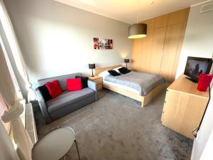 Posteľ alebo postele v izbe v ubytovaní APARTAMENT z 3 SYPIALNIAMI PRZY PLAŻY