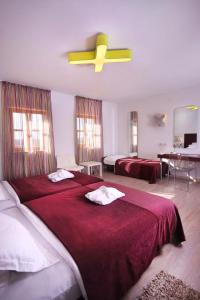 Voodi või voodid majutusasutuse VELANERA Hotel & Restaurant toas