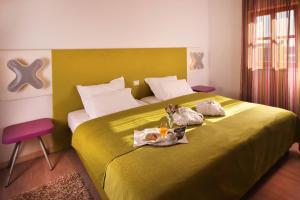 Voodi või voodid majutusasutuse VELANERA Hotel & Restaurant toas