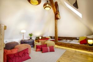 a living room with red and yellow pillows on the floor at Charming APT Old Town Prague by Michal&Friends in Prague