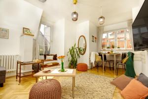 a living room with a couch and a table at Charming APT Old Town Prague by Michal&Friends in Prague