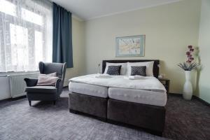 Postel nebo postele na pokoji v ubytování Penzión Hradbová Residence & Spa + 37 fotografií