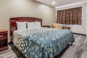Postel nebo postele na pokoji v ubytování Econo Lodge Waco North I-35