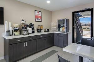 a kitchen with a counter with a coffee maker at Econo Lodge Waco North I-35 in Waco