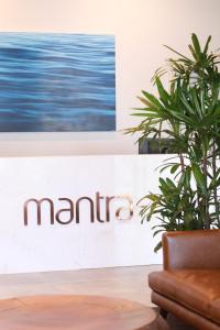 a sign for the marriot with a plant at Mantra Traralgon in Traralgon