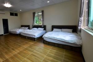 Voodi või voodid majutusasutuse Hongpeng Coffee Station Homestay toas