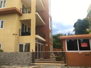 a building with stairs in front of a building at 2 bedrooms appartement at Flic en Flac 100 m away from the beach with shared pool furnished terrace and wifi in Flic-en-Flac