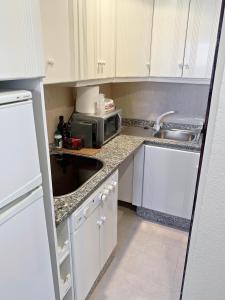 Dapur atau dapur kecil di Apartamentos RG Resitur