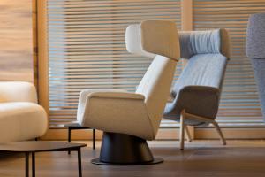 a chair in a room with two other chairs at Alevic Hotel Sirmione in Sirmione