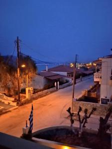 a view of an empty street at night at Villa Constantsia in Káto Ássos