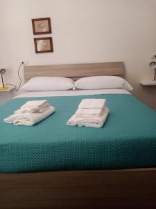 מיטה או מיטות בחדר ב-Mamena