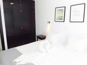 Llit o llits en una habitació de Ocean View Apartment Monseñor