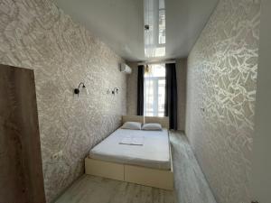 Кровать или кровати в номере Центр города Батуми Apartment Rustaveli 13