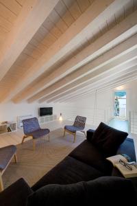 a living room with a couch and two chairs at Pane e Marmellata in Sant'Agnello
