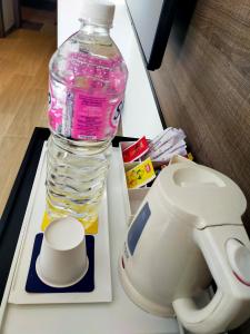 
a bottle of water sitting on top of a counter top at Golden Tulip El Mechtel in Tunis
