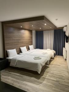 Postel nebo postele na pokoji v ubytování Victoria Inn Tbilisi