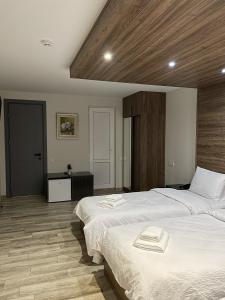 Postel nebo postele na pokoji v ubytování Victoria Inn Tbilisi