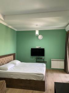 Ένα ή περισσότερα κρεβάτια σε δωμάτιο στο Happy Stay