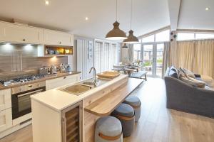 a kitchen with a sink and a counter top at Host & Stay - Puffins Rest in Runswick