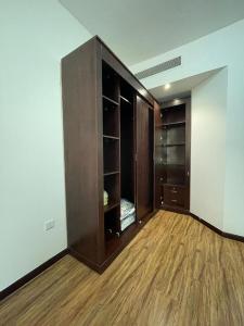 an empty room with a closet and wooden floors at Yacob's The Nest in Ajman 