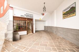 a hallway of a building with a door and a tile floor at Apartamentos Barranco del Infierno in Adeje