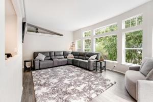 a living room with a couch and a rug at RiverSong in Tillamook