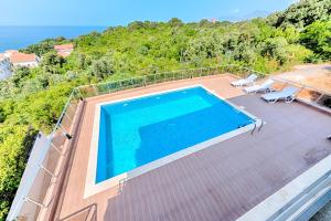 an image of a swimming pool on a house at Apartmani Panorama in Bar