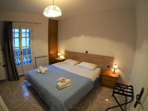 Postel nebo postele na pokoji v ubytování Galaxy Rooms