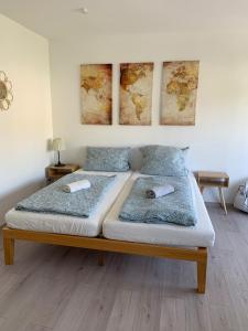 two beds in a bedroom with two pillows on them at The HIKER City Apartment in Koblenz