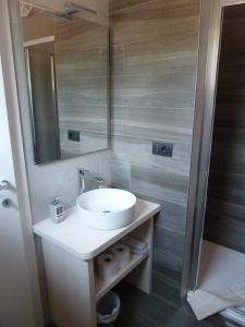 a bathroom with a sink and a mirror at Bellagio Il Crotto in Bellagio +55 photos