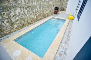Bazén v ubytování Acogedora casa en Punta Cana Amueblada nebo v jeho okolí