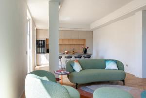 a living room with a couch and a table at Lunam Penthouse in centre in Lucca